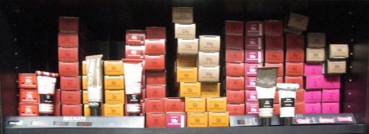 lot 1076 image: Shelf Full of  Hair Color Tubes