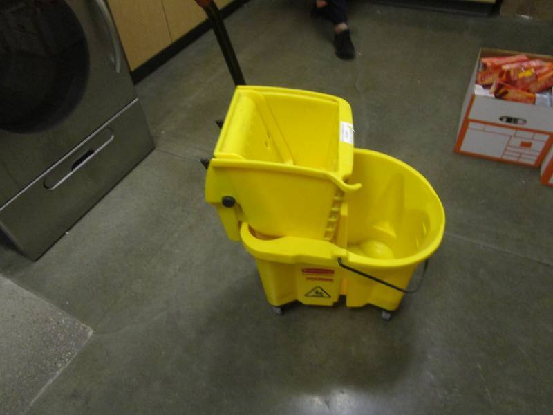 lot 1119 image: Rubbermaid Commercial Yellow Mop Bucket with Wringer