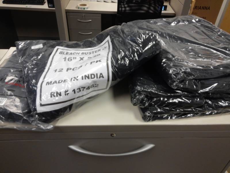 lot 1207 image: Packs of 12 Black Partex Royale Bleach Guard Salon Towels