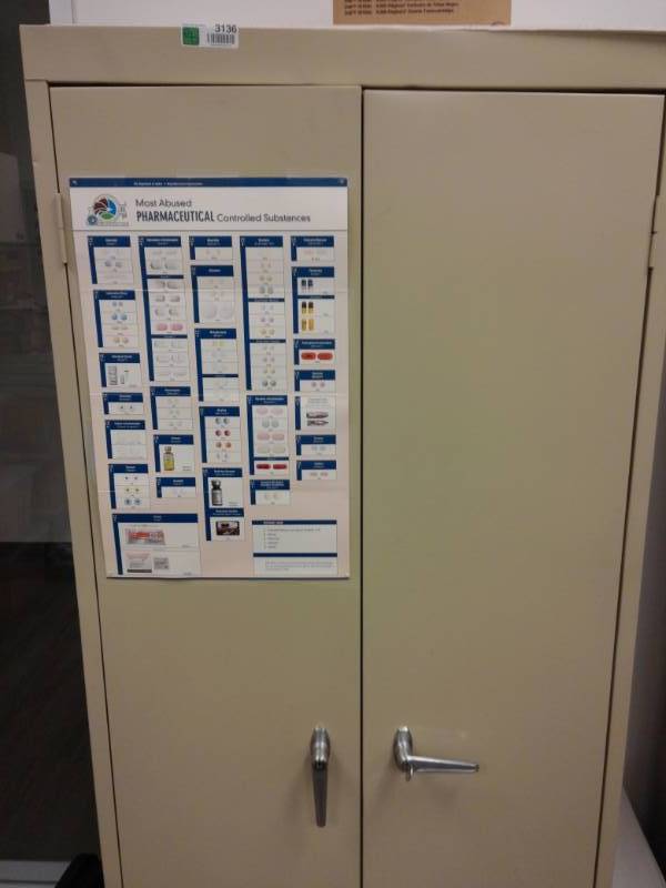 lot 3136 image: Metal Two Door Storage Cabinet Contents Included
