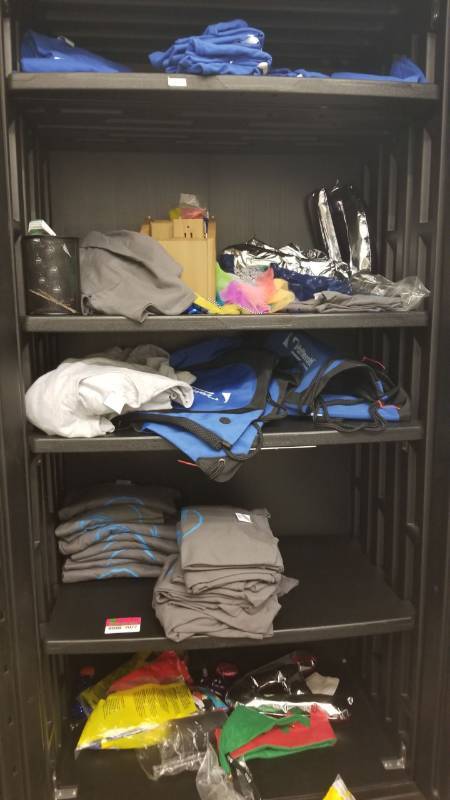 lot 9077 image: Large lot of T shirts backpacks miscellaneous promo items