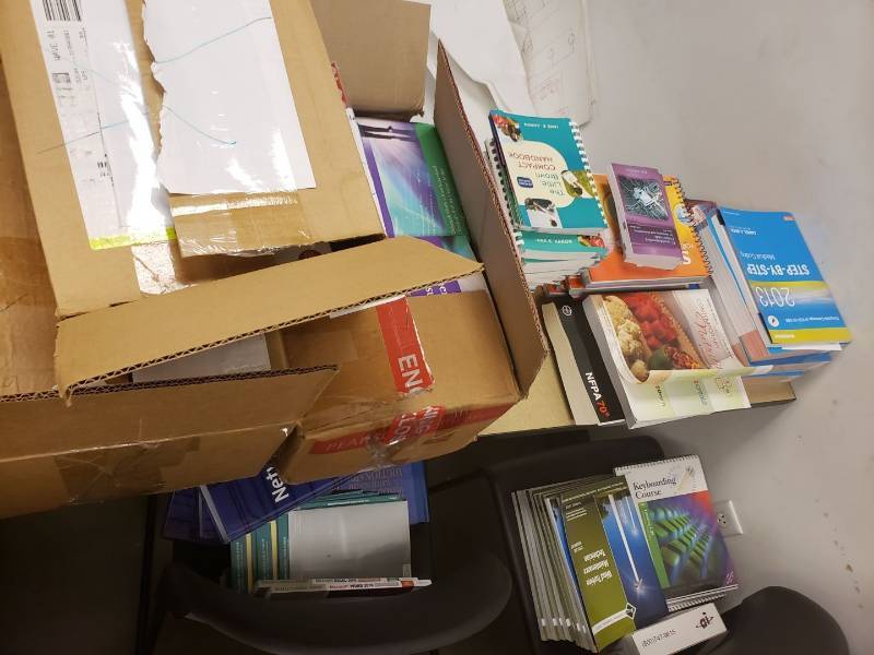 lot 9165 image: Lot of textbooks on table