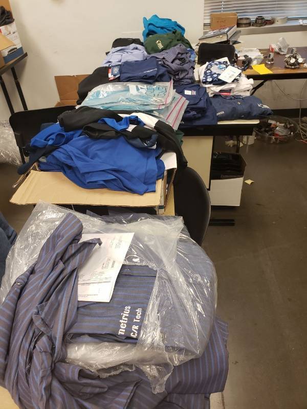 lot 9171 image: Lot of work shirts on table