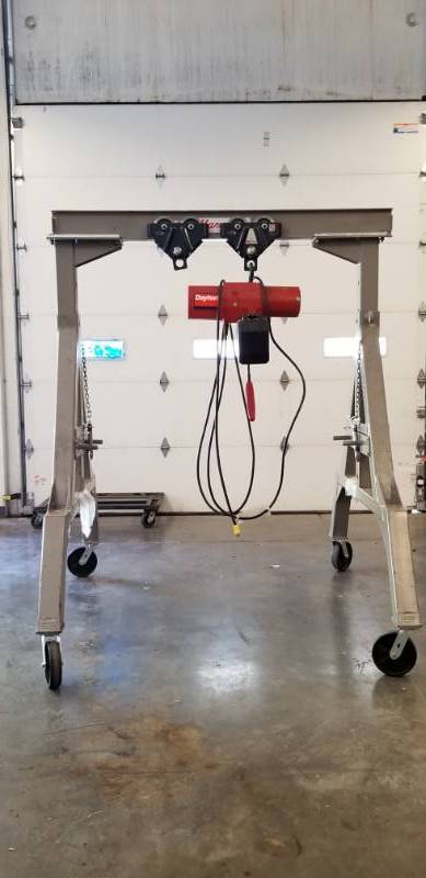 lot 8151 image: Dayton Model 3YB91 Electric Chain Hoist, 2000 lb. Load Capacity mounted on Steel Rolling Frame See Video