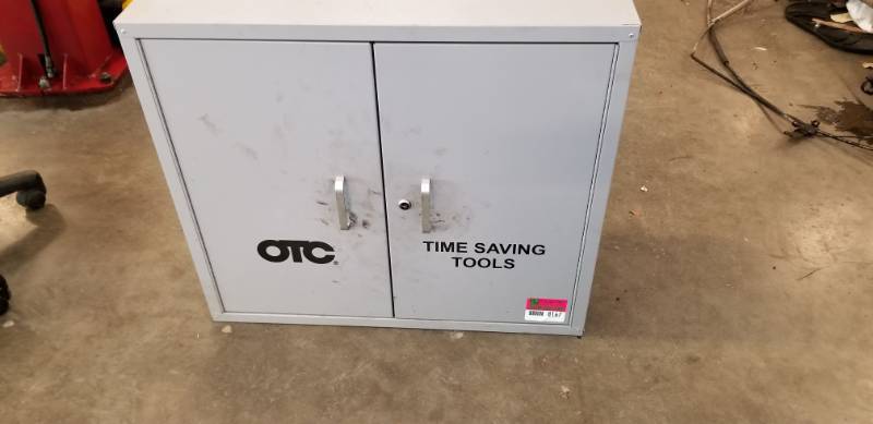 lot 8167 image: Two Door Metal Storage Cabinet with Hangers Mounted Inside