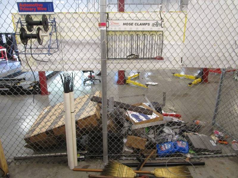 lot 8175 image: Auto Primary Wire Rack, Hose Clamps Rack Brooms and Other Misc
