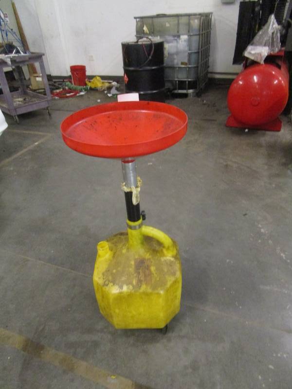 lot 8204 image: Oil Catch Pan on Catch Jug