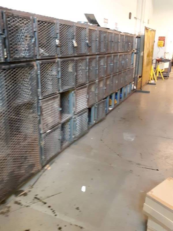lot 9557 image: Bank of Cube Lockers with Steel Grate Doors Contents Included Buyer Must Remove