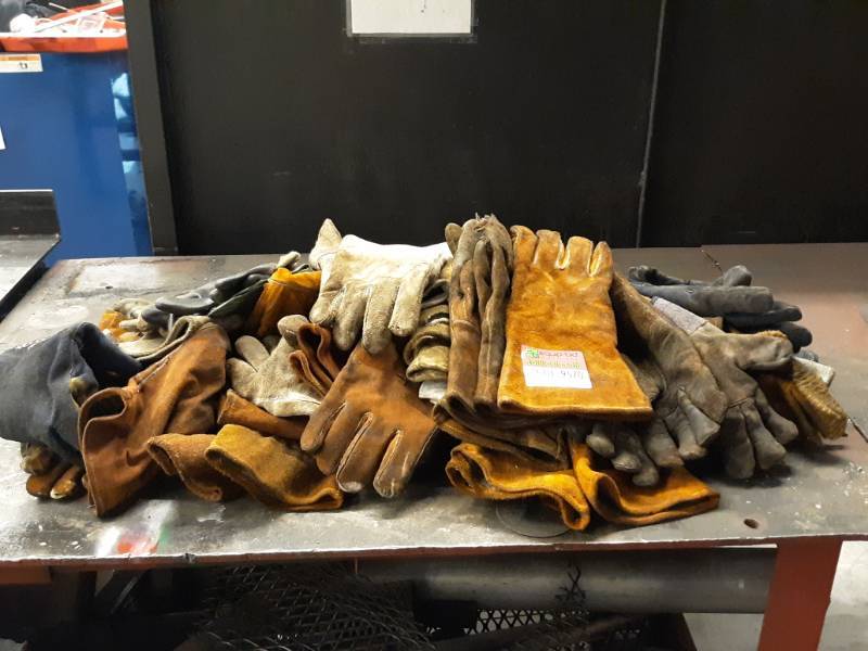 lot 9570 image: Table Full of Leather Welding Gloves