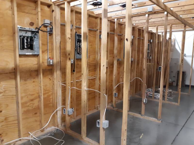 lot 8412 image: Room Full of 10 Breaker Boxes and Panels Buyer Must Remove