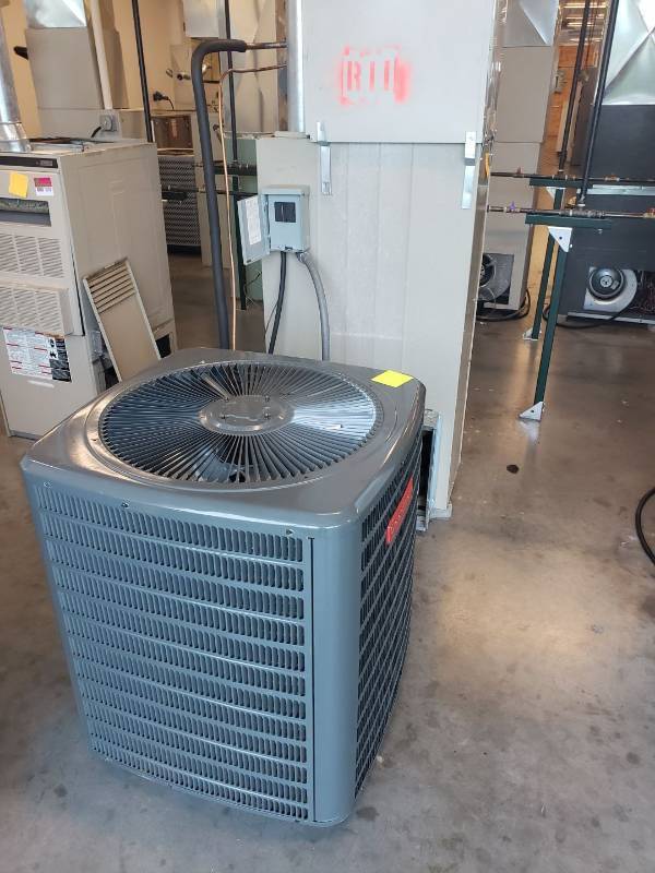 lot 8003 image: Trane Furnace and Goodman Air Conditioner