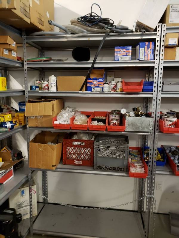 lot 8243 image: Metal storage rack with contents