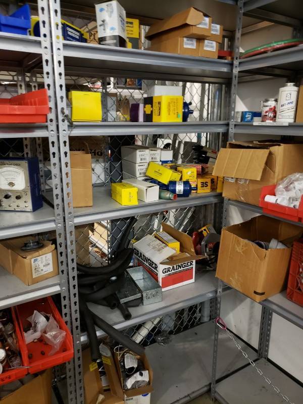 lot 8244 image: Metal storage rack with contents
