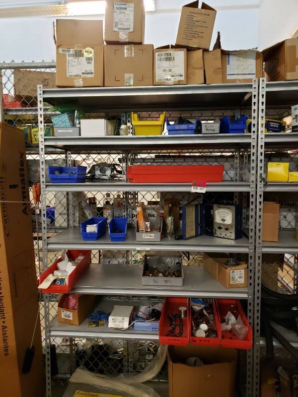lot 8245 image: Metal storage rack with contents