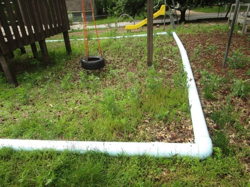 lot 5058 image: White Plastic Pipe used for Playground Edging - Buyer Must Remove