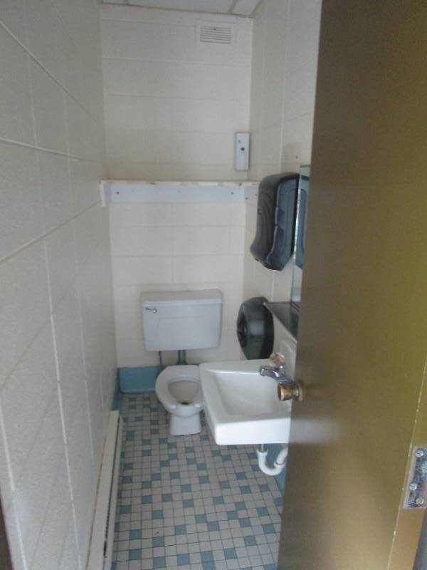 lot 5066 image: Bathroom Fixtures - Wall Hanging Porcelain Sink, Stool, Paper Towel, Toilet Paper and Hand Soap Dispensers