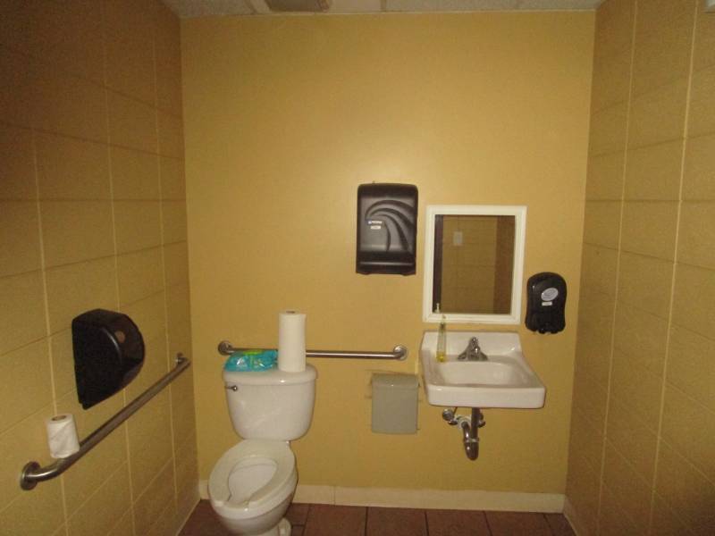 lot 5069 image: Bathroom Fixtures - Wall Hanging Porcelain Sink, Stool, SS Grab Bars x2, Paper Towel, Toilet Paper and Hand Soap Dispensers