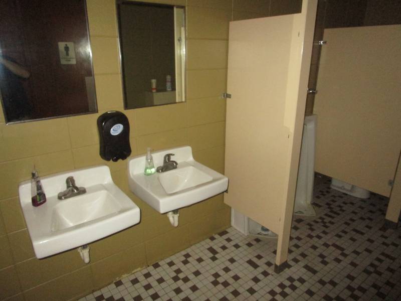 lot 5070 image: Bathroom Fixtures - Wall Hanging Porcelain Sink x2 , Stool, Double Urinal, Paper Towel, Toilet Paper and Hand Soap Dispensers