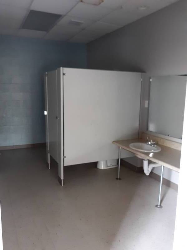 lot 5201 image: Bathroom Stall walls and Door, Sink Counter and Drop in Sinks, Stool- Buyer Must Remove