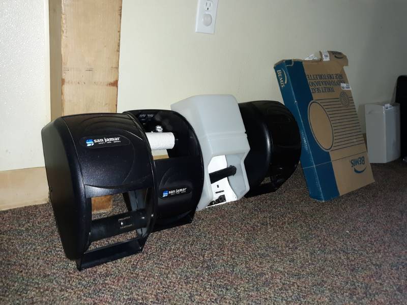lot 5025 image: SanJamar Towel Dispensers and Box of Toilet Seat Covers