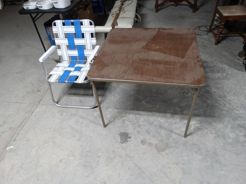 lot 6100 image: Card table, no chairs and a lawn chair.