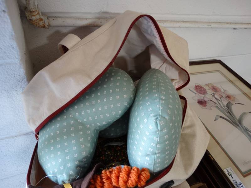 lot 6164 image: Bag with small heart shaped pillows and a witch doll.