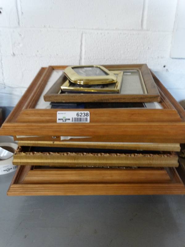 lot 6238 image: Lot picture frames and water damaged pictures.