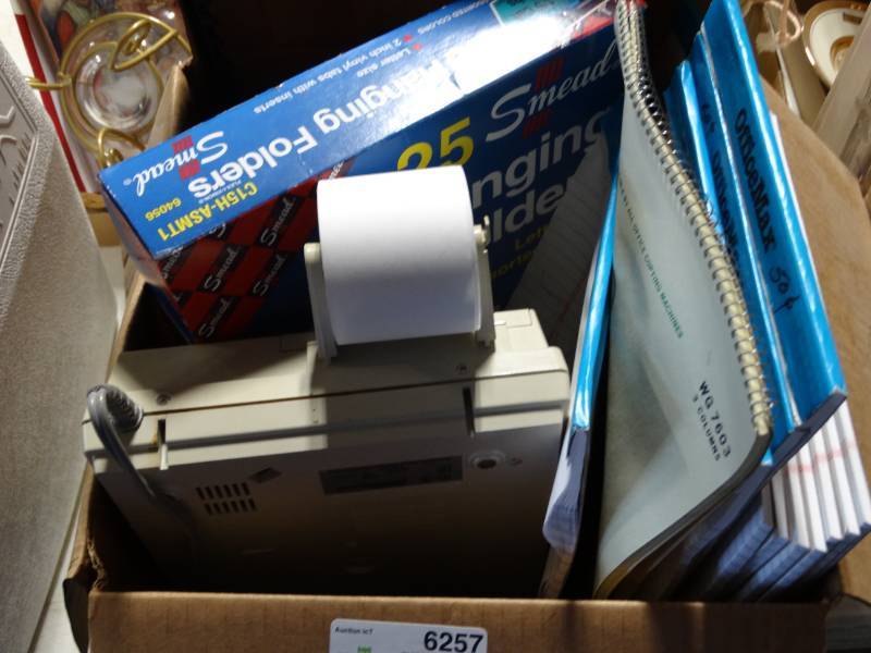 lot 6257 image: Lot with note pads, recipet machine, folders and more.