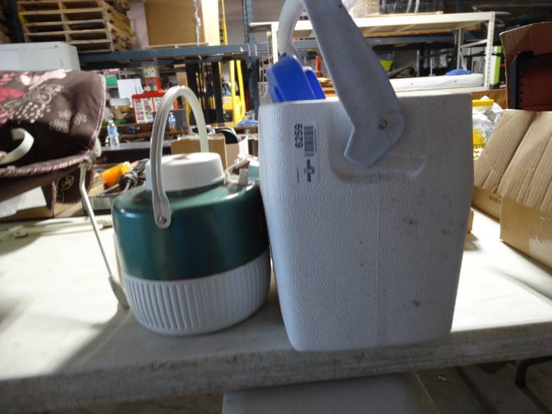 lot 6259 image: Small cooler and coleman water jug.