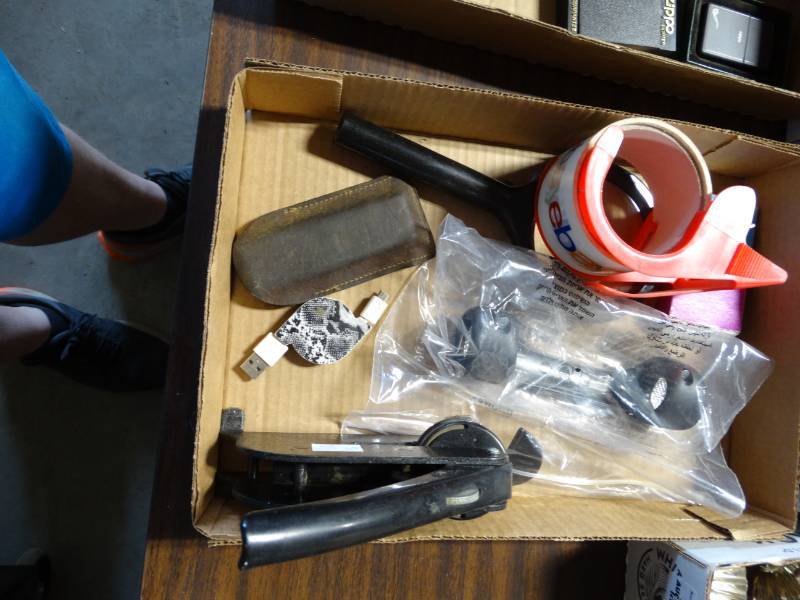 lot 6280 image: Ebay tape, charger, magnifying glass and more.