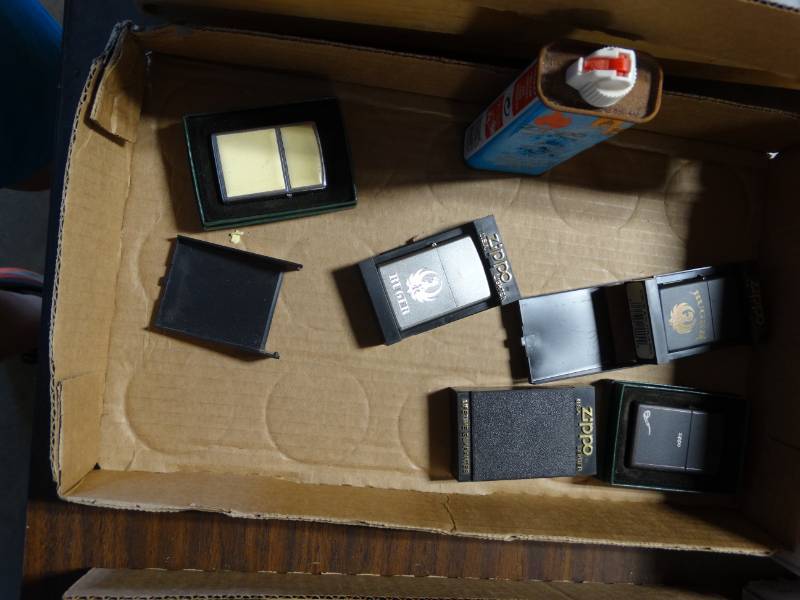 lot 6282 image: Zippo lighters and light fluid almost empty.