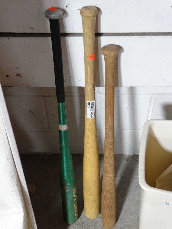 lot 6304 image: 2 Wood baseball bats and a metal baseball bat.