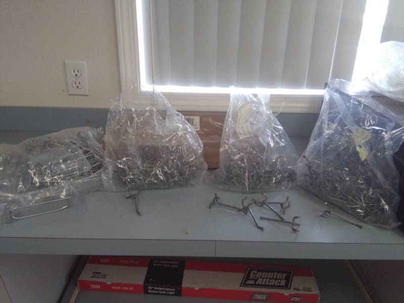 lot 2386 image: Bags Full of Peg Board Hooks, Some Panel Wall Hooks included