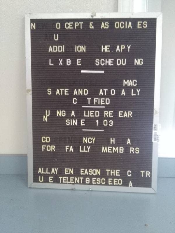 lot 2389 image: Vintage Display Sign with Small Plastic Stick in Letters.  Back side is Cork