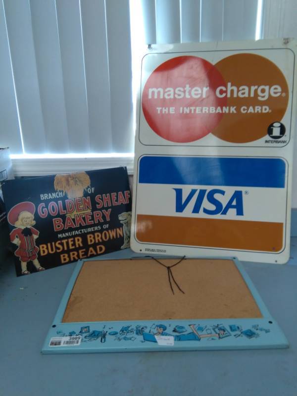 lot 3989 image: Two Metal Advertising Signs and 70s Girls Bulletin Board