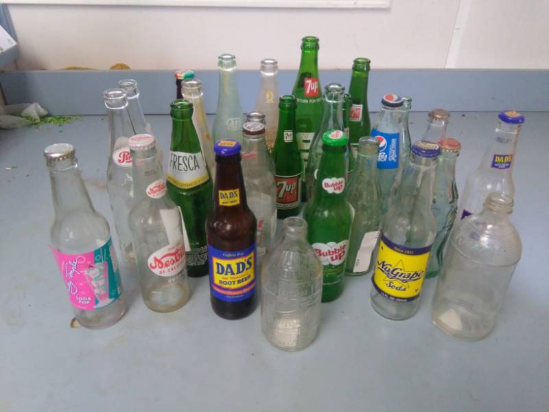 lot 7332 image: Vintage and Collectible Pop  Soda Bottles