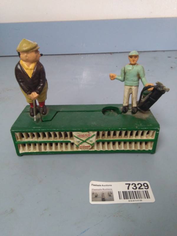 lot 7329 image: Vintage Golf Cast Iron Bank