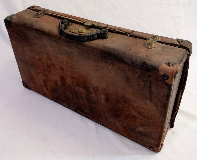 lot 1863 image: Leather With Metal Corners Suitcase- Oh If This Could Talk 