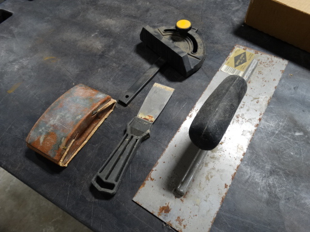lot 6352 image: Putty knife, mitter guage, 14 trowel and a hand sander.