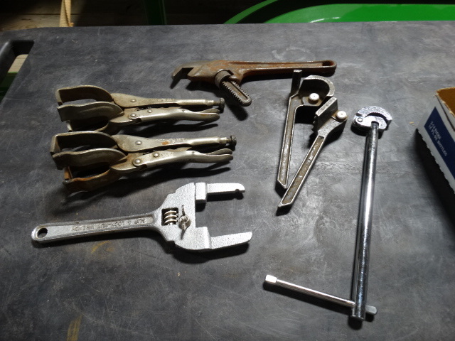 lot 6353 image: Lot with vise grips, lock nut wrench, basin wrench, tube bender and a ridgid hex wrench.