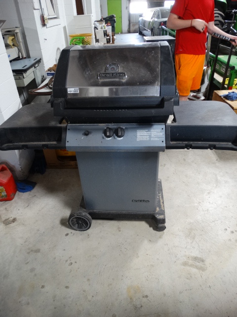 lot 6359 image: Broil king grill with tank.