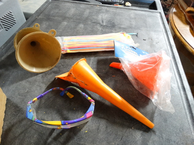 lot 6396 image: Lot of funnels, zip ties and safety glasses.