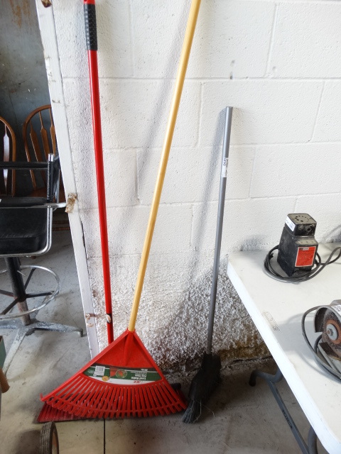 lot 6439 image: 2 Brooms and a rack.