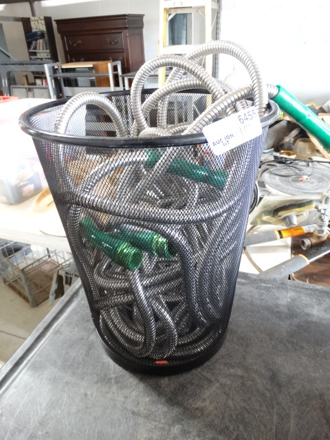 lot 6455 image: Water hose and a trash can.