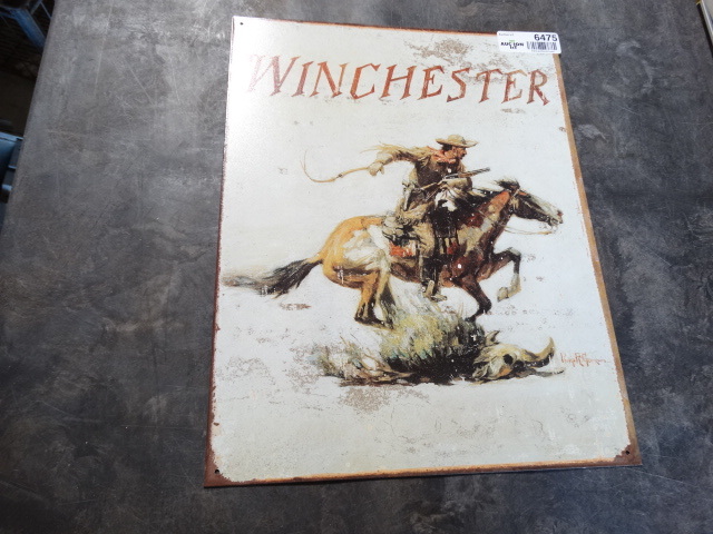 lot 6475 image: Winchester metal wall art.