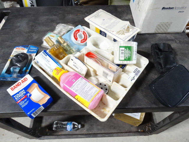 lot 6524 image: Lot with silverware holder, Q-Tips, round furniture cups, Accu check and more.