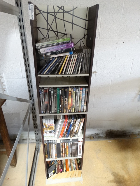 lot 6565 image: Lot of movies, CDs and books on shelf.