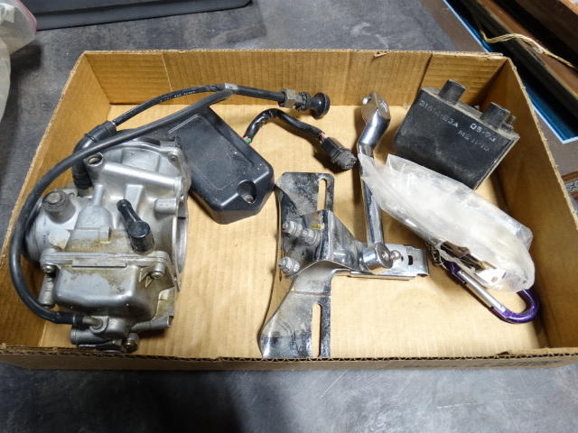 lot 6592 image: Lot with brackets, motorcycle parts.
