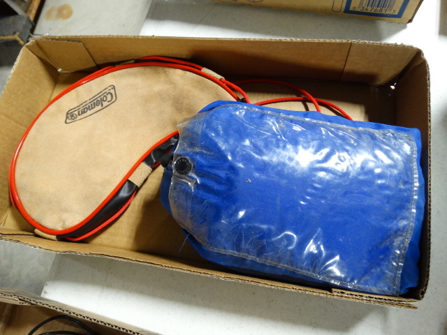 lot 6603 image: Coleman water bag and stearns pants.