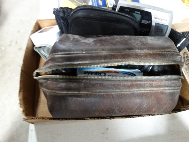 lot 6604 image: Mens shaver, floss, iceyhot, bag blood pressure machine and more.
